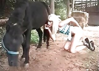 Bimbo whore with blonde hair deepthroats the cock of a stallion