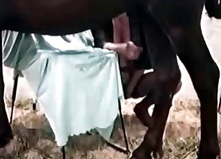 Total whore having some nasty fun with a dark-skinned horse